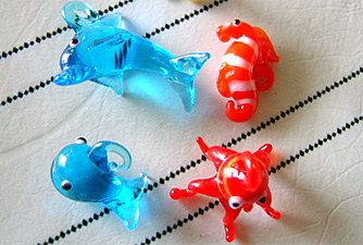 glass dolphin, glass seahorse, glass starfish